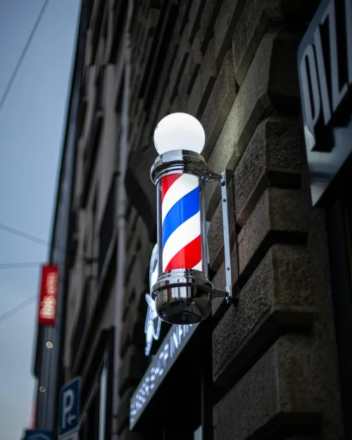 A nighttime view of an outdoor barber pole